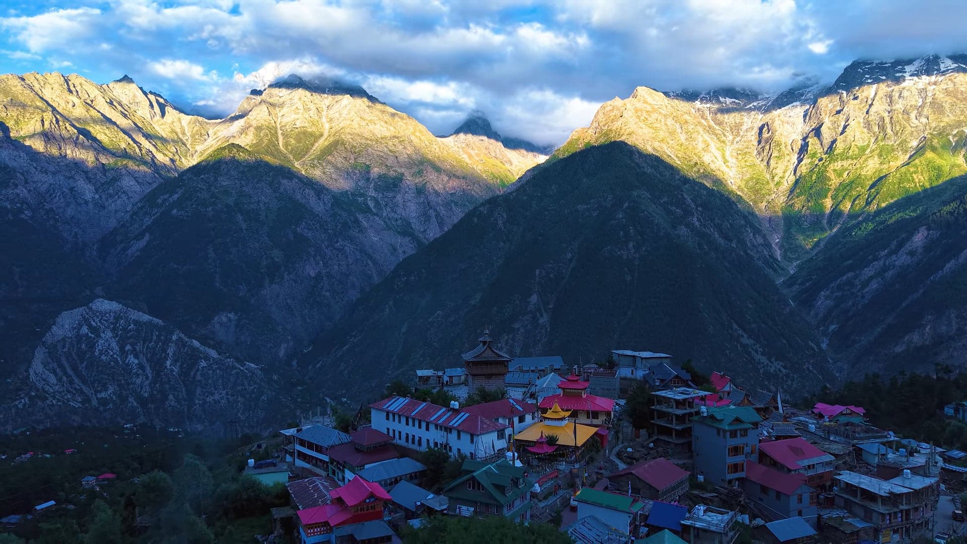 Kalpa village in Kinnaur at golden hour, with the Kinner Kailash range rising behind it
