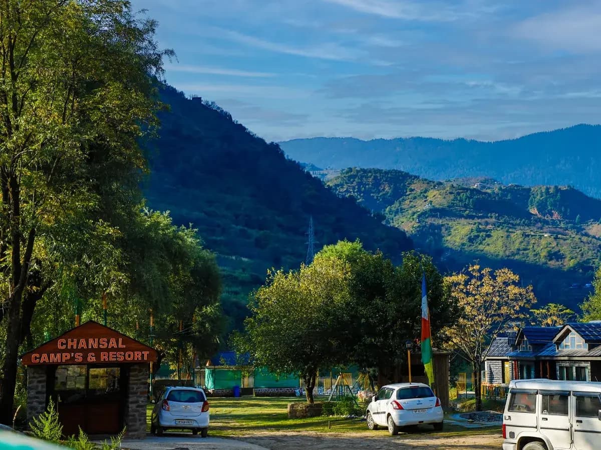 Resort entrance among trees and hills near Rohru
