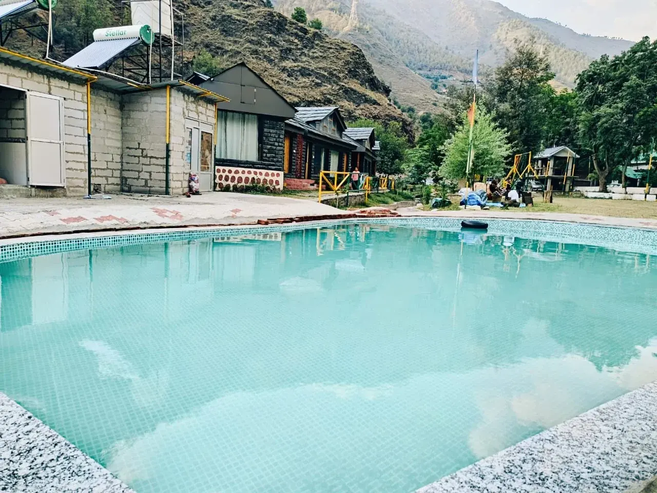Swimming pool in front of the cottages