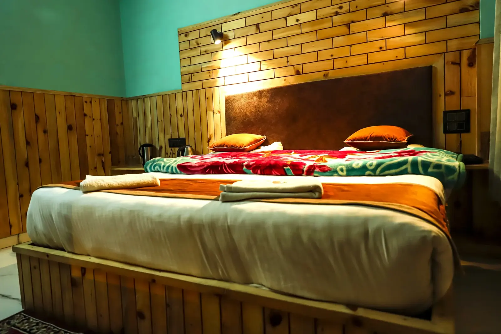 Room with warm wood and turquoise walls