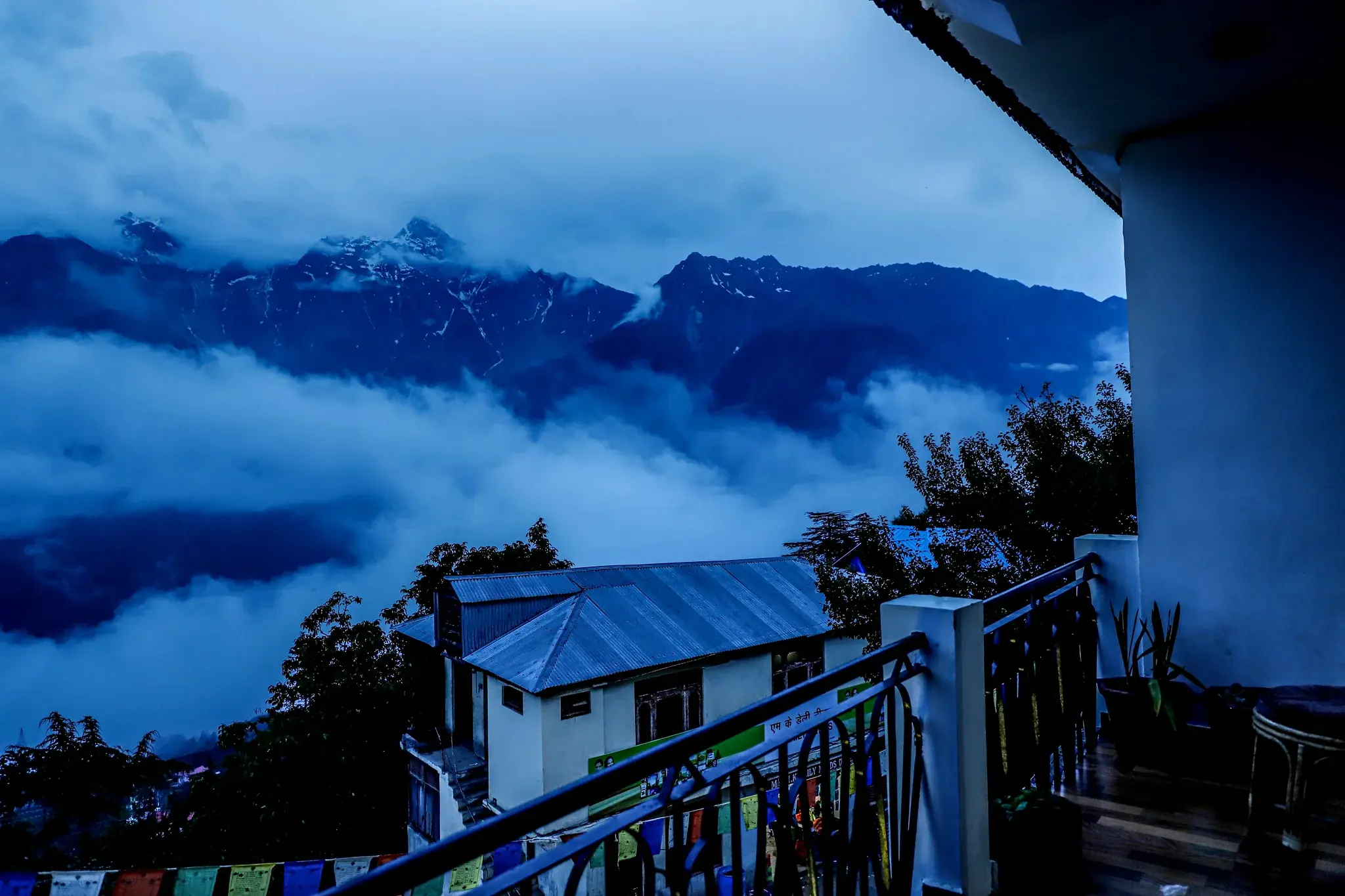 The Kinner Kailash range rising above the clouds from a Hotel Royal Voyages balcony