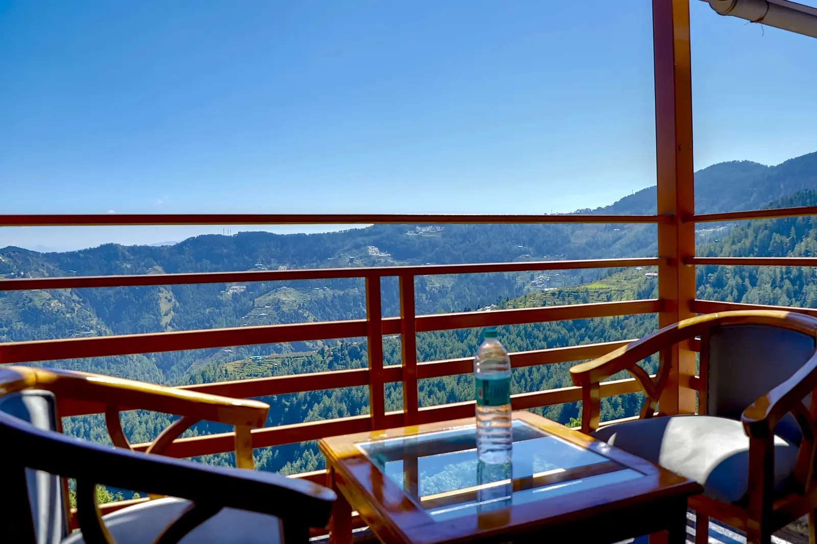 Private balcony with chairs above the valley