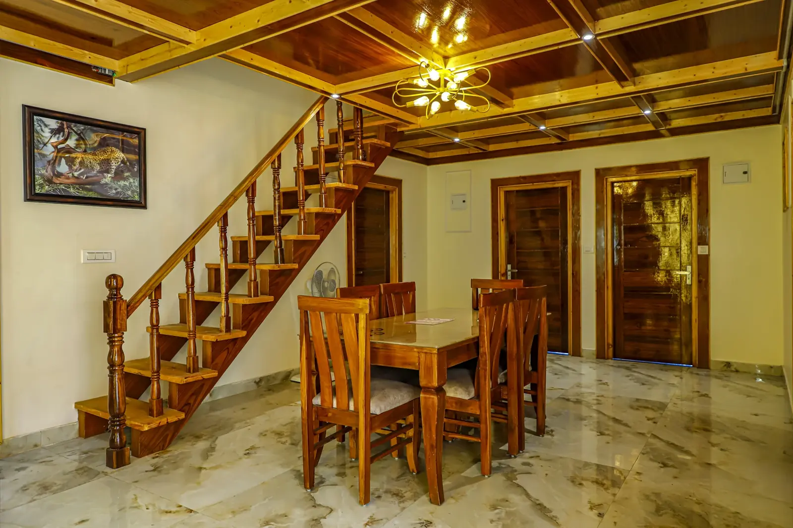 Dining hall with a wooden staircase