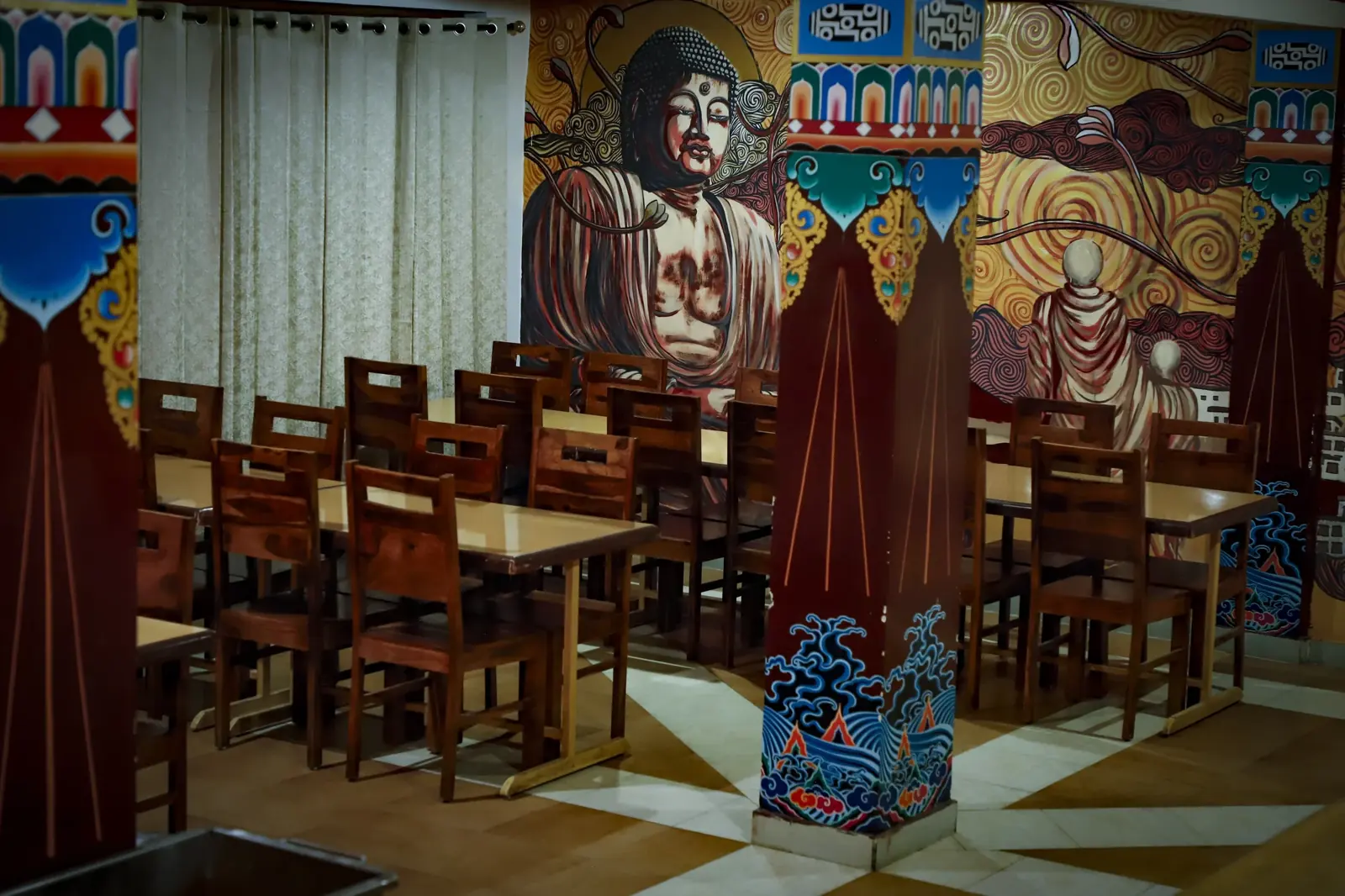 Dining room with a hand-painted Buddhist mural